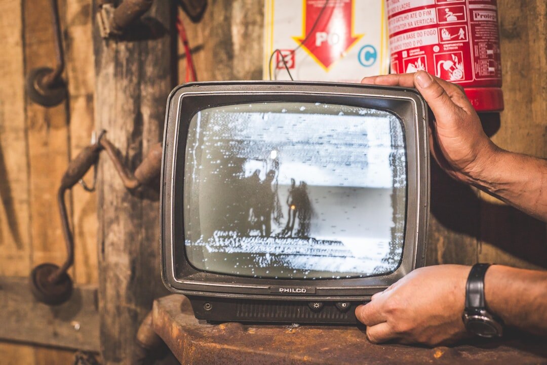 group watching old tv